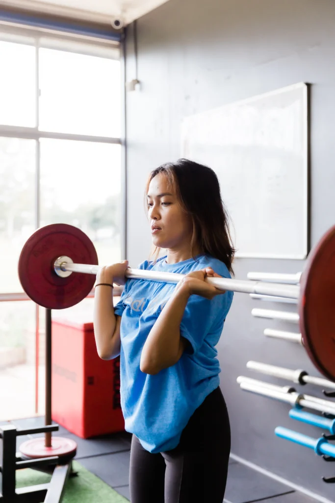 Student learning overhead press in personal fitness course