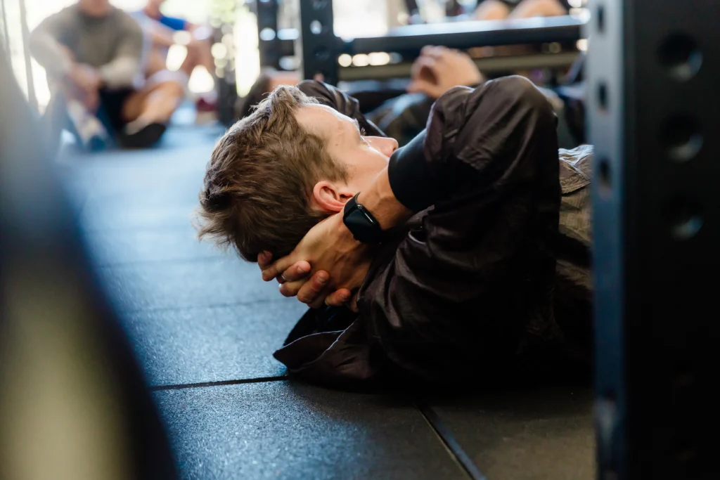 Gym photo with fitness trainer in middle of exercise